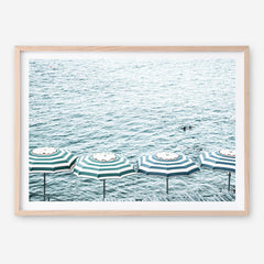 Shop Capri Island Umbrellas Photo Art Print a coastal themed photography wall art print from The Print Emporium wall artwork collection - Buy Australian made fine art poster and framed prints for the home and your interior decor, TPE-872-AP