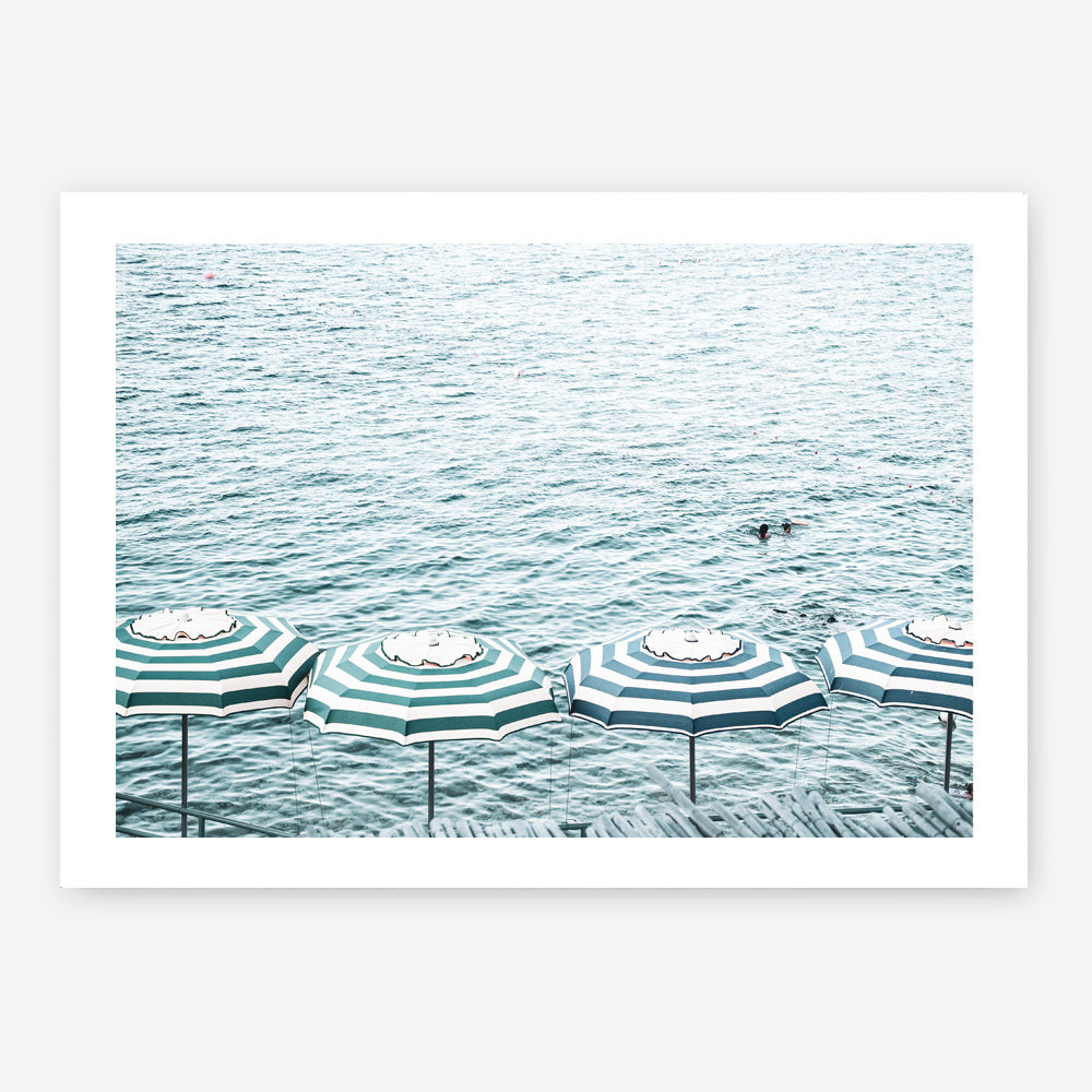 Shop Capri Island Umbrellas Photo Art Print a coastal themed photography wall art print from The Print Emporium wall artwork collection - Buy Australian made fine art poster and framed prints for the home and your interior decor, TPE-872-AP