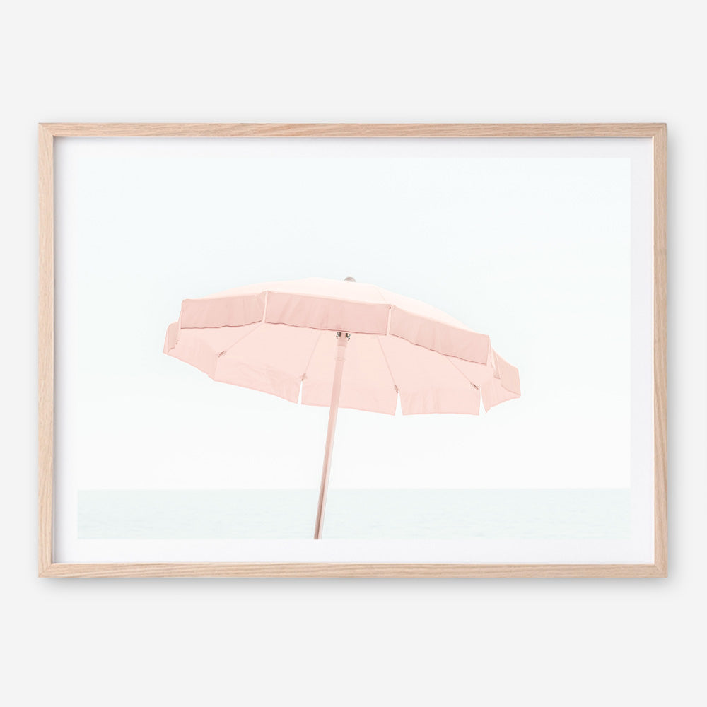 Shop Pink Parasol Photo Art Print a coastal themed photography wall art print from The Print Emporium wall artwork collection - Buy Australian made fine art poster and framed prints for the home and your interior decor, TPE-543-AP